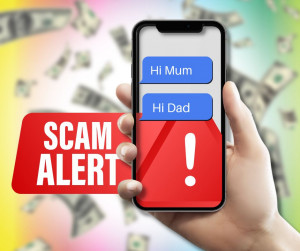Hand holding scam messages stating "Hi Mum" and "Hi Dad"